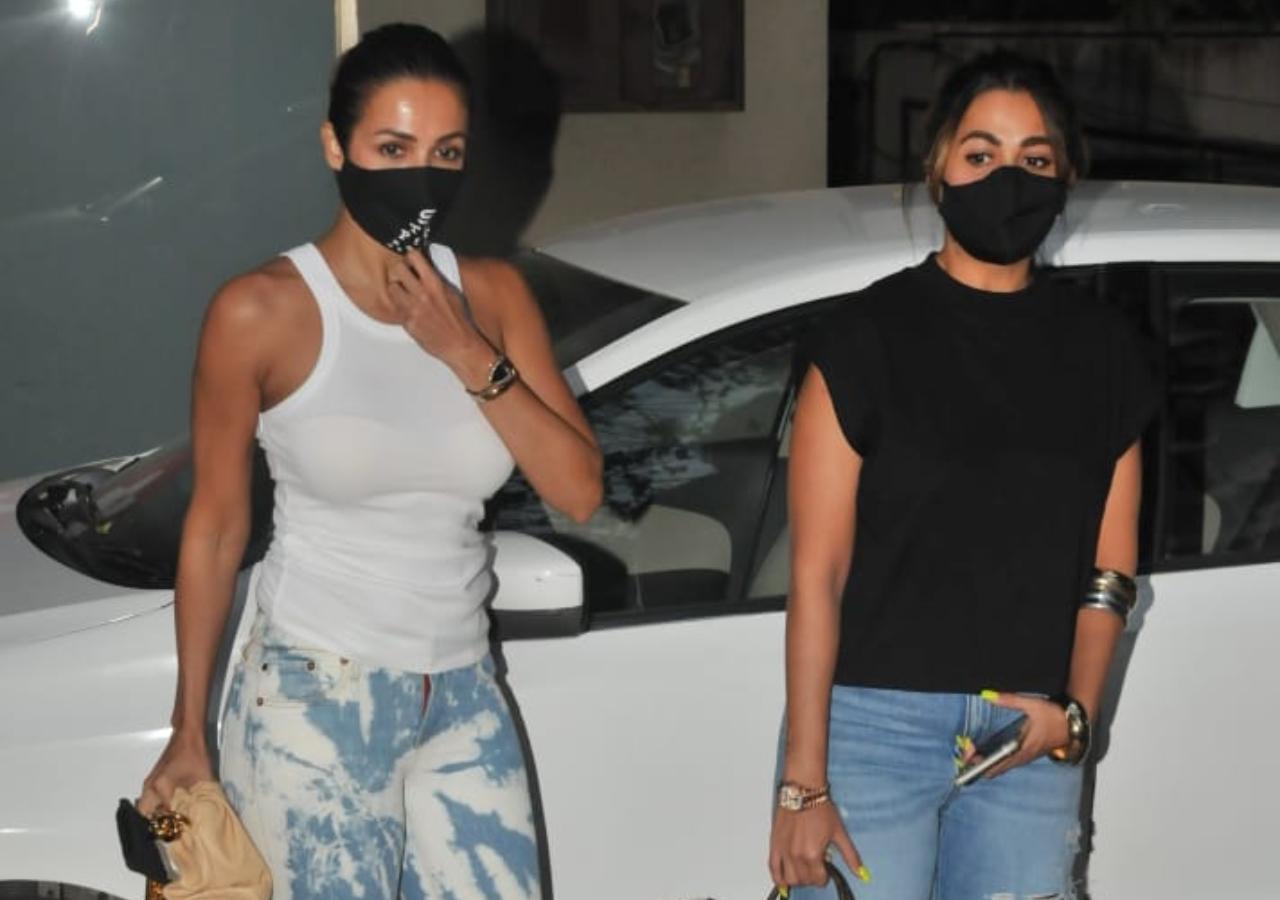 Malaika Arora was snapped with her sister Amrita Arora arriving at Manish Malhotra's residence in Bandra, Mumbai. The fashion designer was hosting a grand party (All pictures: Yogen Shah).