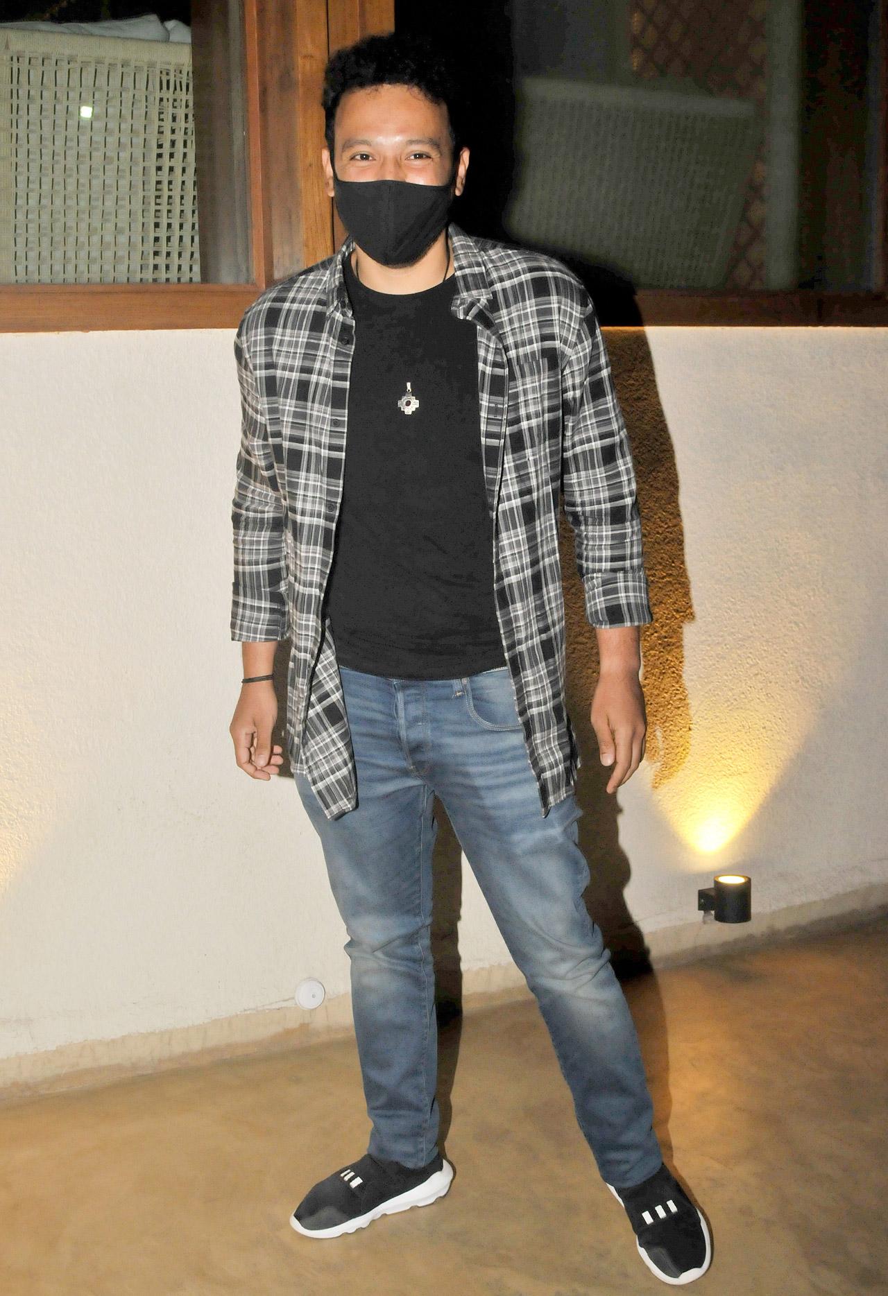 Rohan Shrestha opted for a very casual yet smart look. For his birthday dinner, he sported a black t-shirt, checkered shirt and jeans.