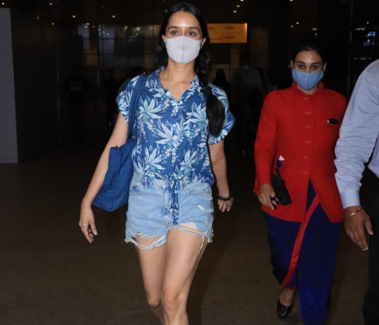 Shraddha Kapoor seemed to be in a bit of a hurry as she was snapped at the Mumbai Airport. The actress, who will be seen romancing Ranbir Kapoor in Luv Ranjan's as-yet-untitled project opted for a blue printed top and denim. (All pictures: Yogen Shah).