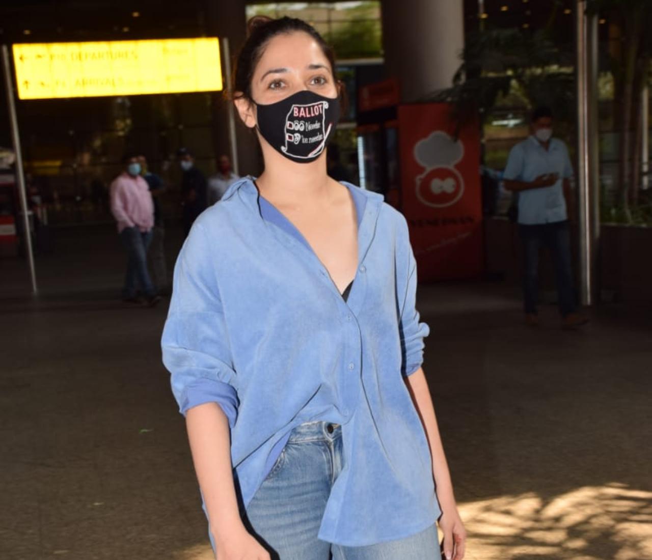 Tamannaah Bhatia opted for a blue dress and denim as she was clicked at the airport.