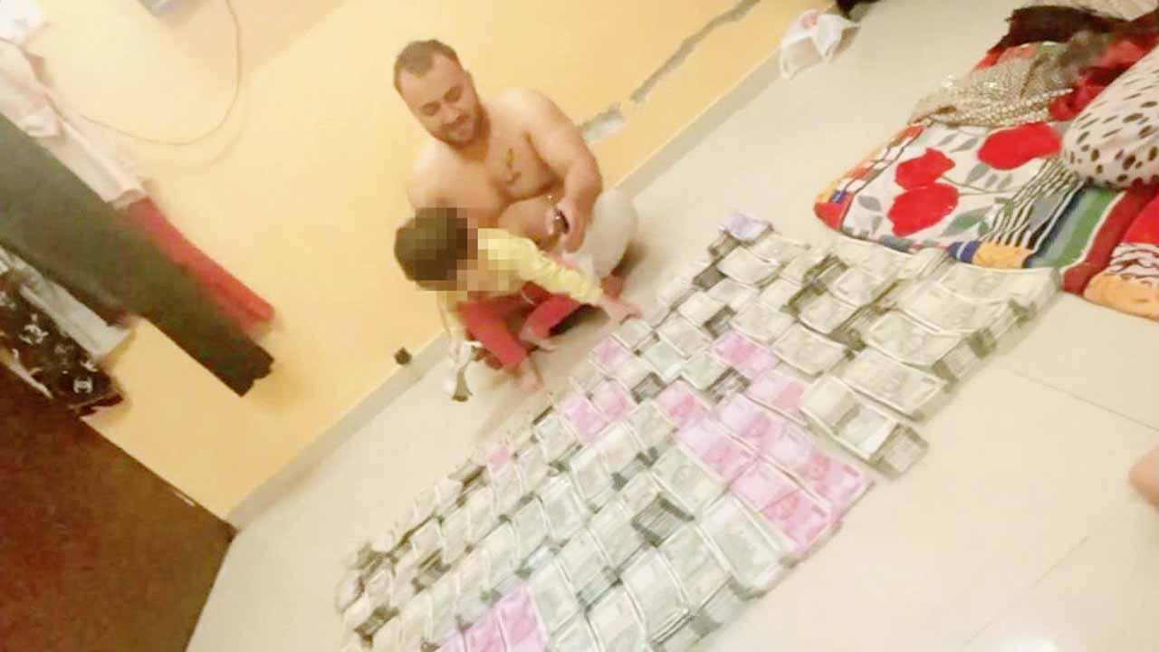 Mumbai: History-sheeter posts video of him and his kid playing with bundles of cash