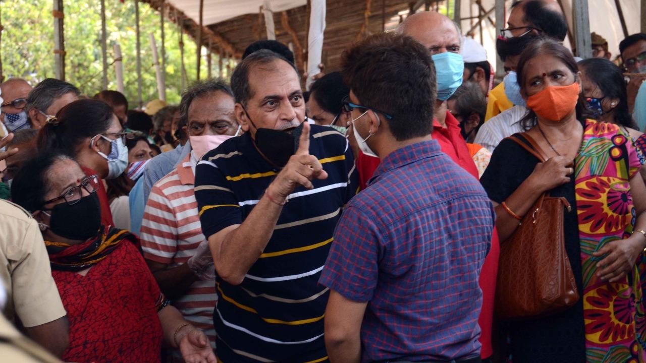 Recently, BMC Commissioner Iqbal Singh Chahal said that war rooms, dashboards for bed management, prohibition of release of test report directly to patients, and the decision not to dismantle jumbo Covid-19 facilities proved useful in the fight against the second wave of the novel coronavirus.
In picture: A citizen argues with an official at a vaccination centre in Mumbai. Photo: Satej Shinde