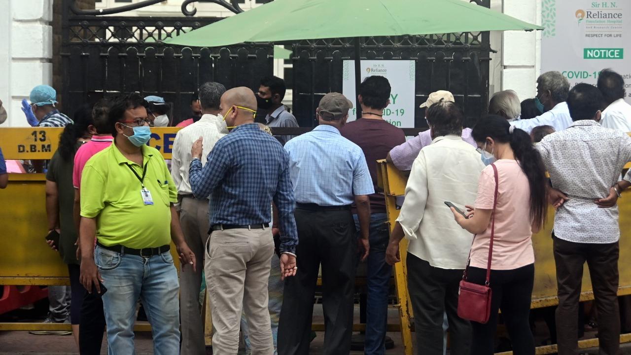 In picture: People wait outside the Reliance Hospital in South Mumbai for Covid-19 vaccination. Photo: Bipin Kokate