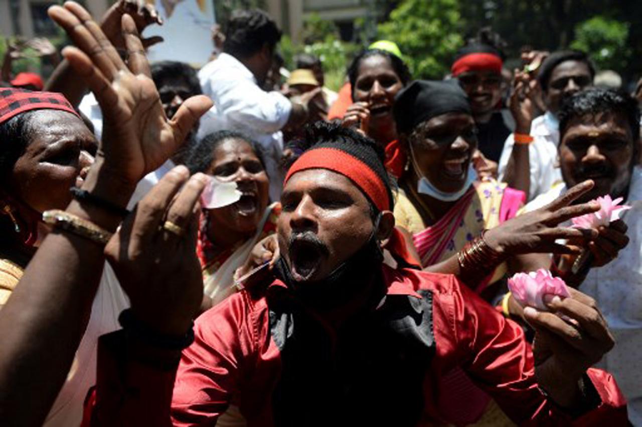 In picture: Members of the Dravida Munnetra Kazhagam (DMK) party seen violating social distancing norms as they celebrate their party's lead in major seats of the Tamil Nadu state legislative assembly elections at party headquarters in Chennai. Photo/AFP