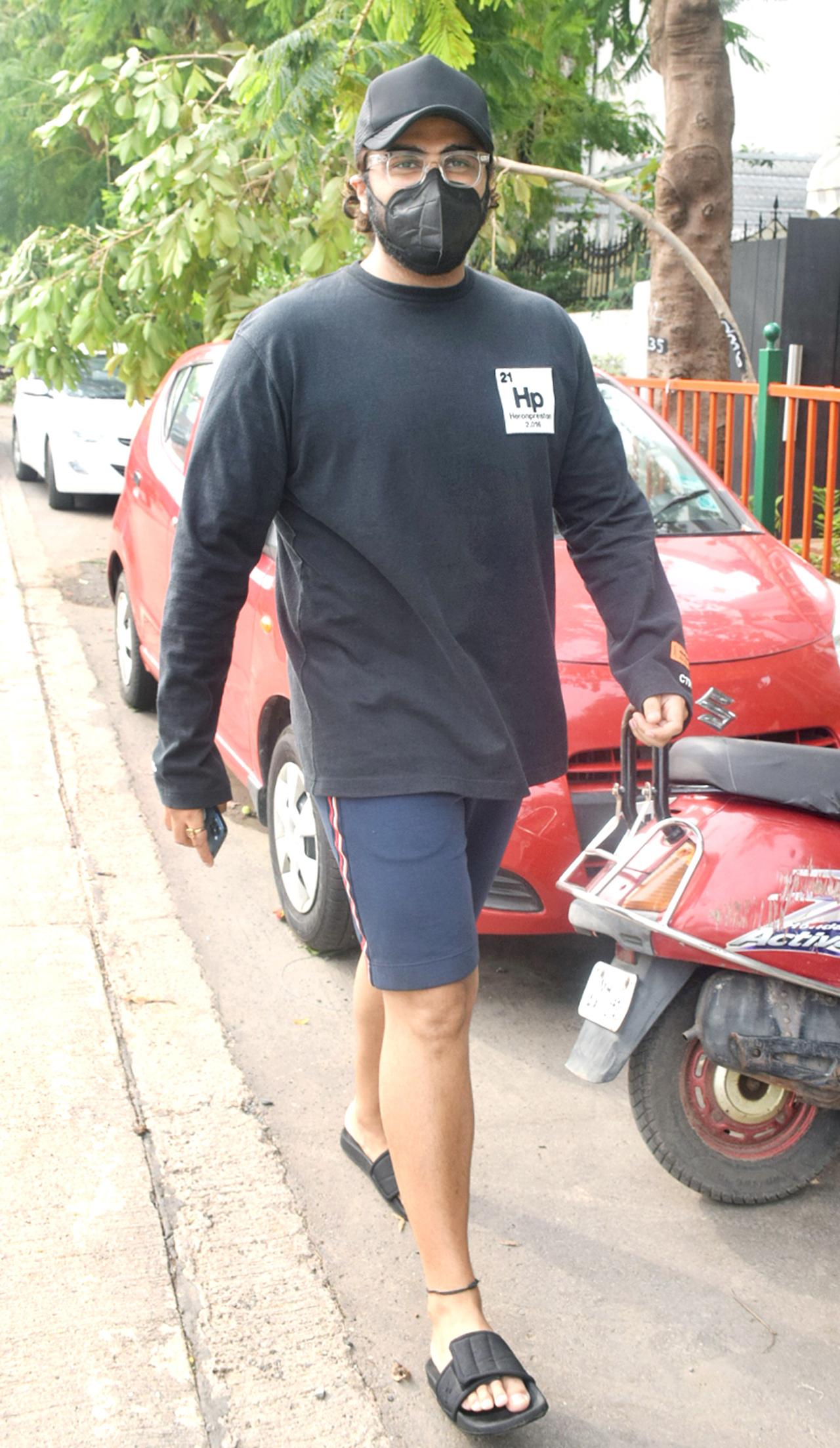 Khushi's sibling, elder brother-actor Arjun Kapoor was snapped in Lokhandwala. The actor, who stepped out to pay a visit to his grandmother's house, was seen in a comfy attire - black sweatshirt, paired with blue shorts, a cap and flip flops.