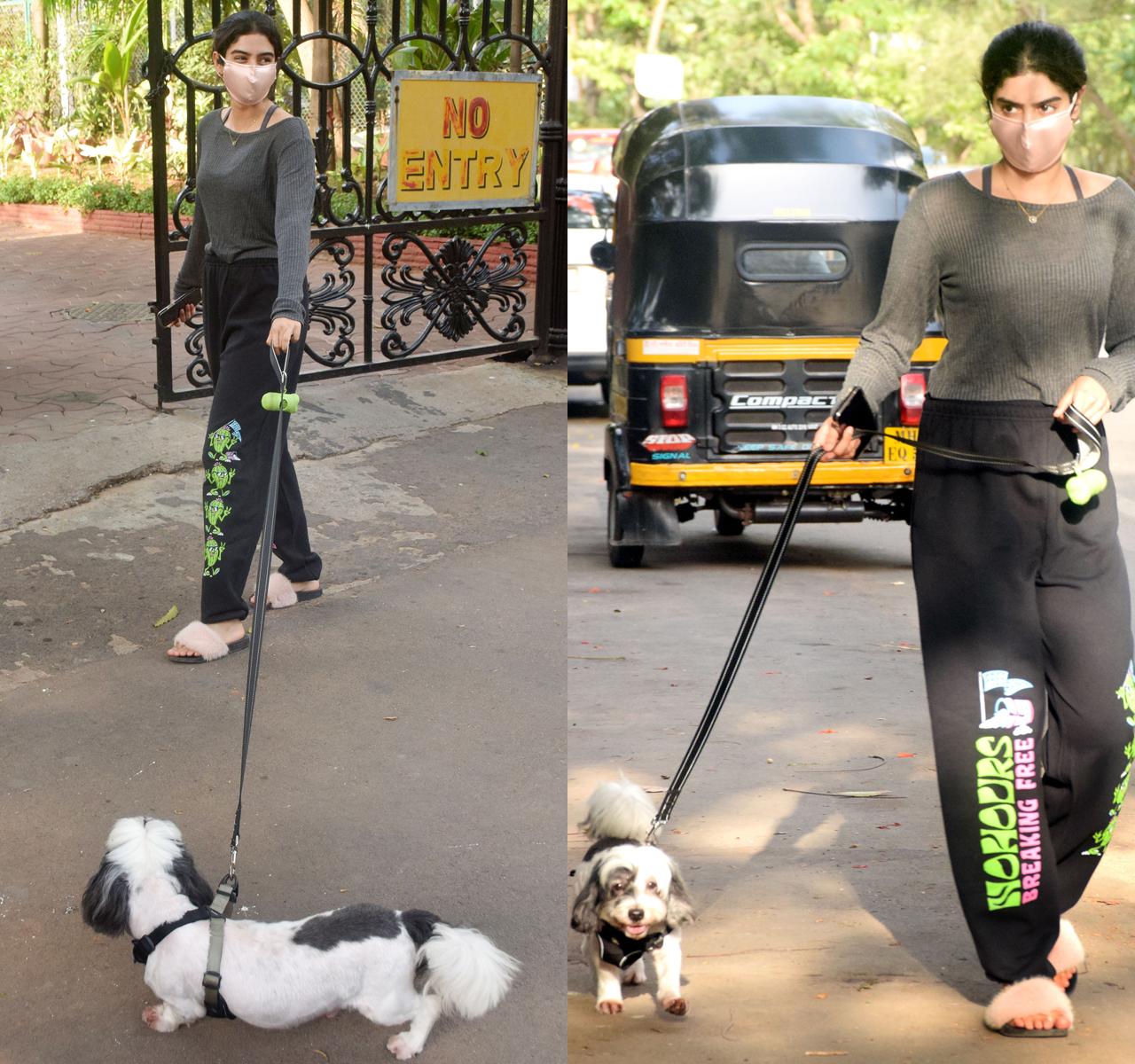 Khushi Kapoor was clicked with her cute pet dog, Panda. The star kid stepped out to take her pet on a walk, in and around the premises of her residence in Andheri Lokhandwala.