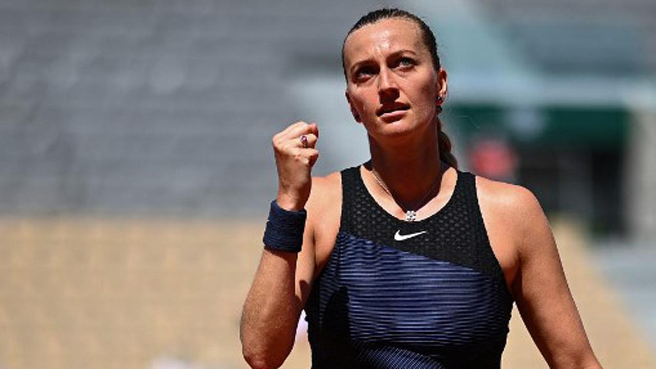 French Open: Petra Kvitova saves match point to stay afloat