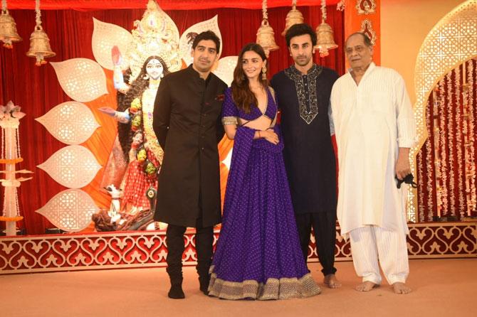 Alia Bhatt, Ranbir Kapoor and close friend filmmaker Ayan Mukerji posed with Debu Mukherjee at the North Bombay Sarbojanin Durga Puja pandal for Kali Puja.