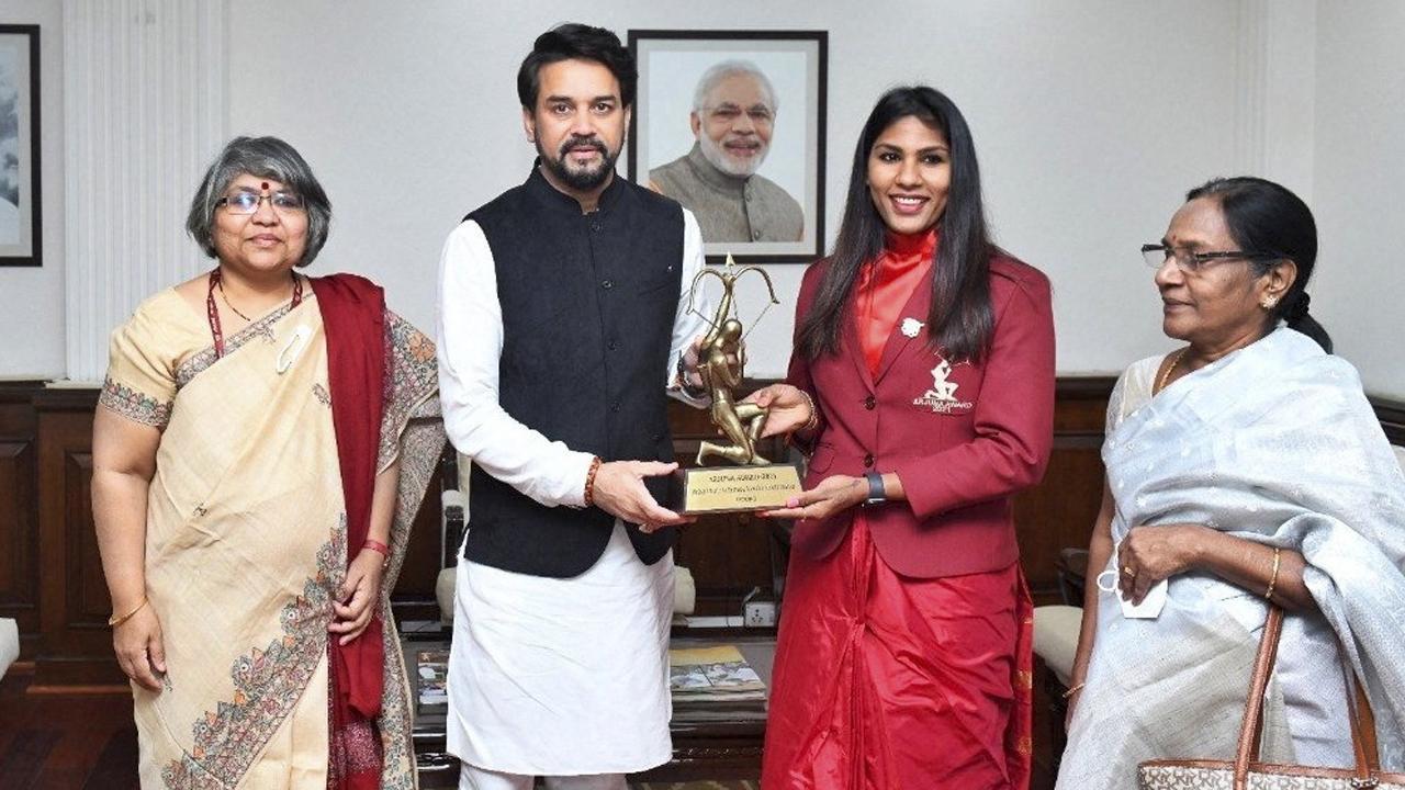 Fencer Bhavani Devi receives her Arjuna Award from sports minister Anurag Thakur