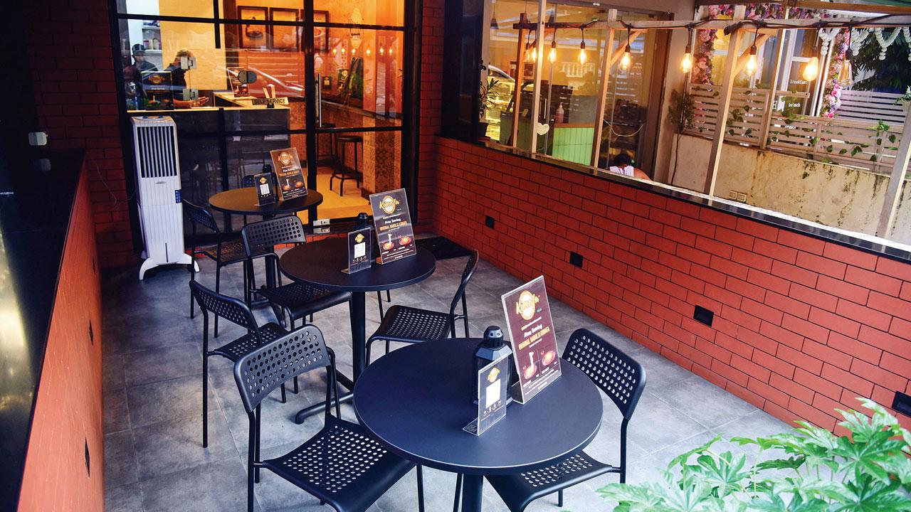 The cafe has three tables for outside seating and battery-lit candles in a lantern. Pics/Shadab Khan
