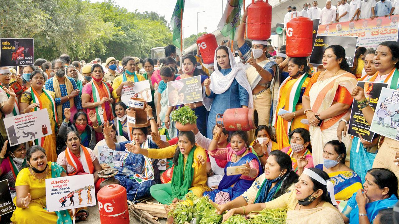 Cong members protest fuel & LPG price hike, in Bengaluru. File pic/AFP