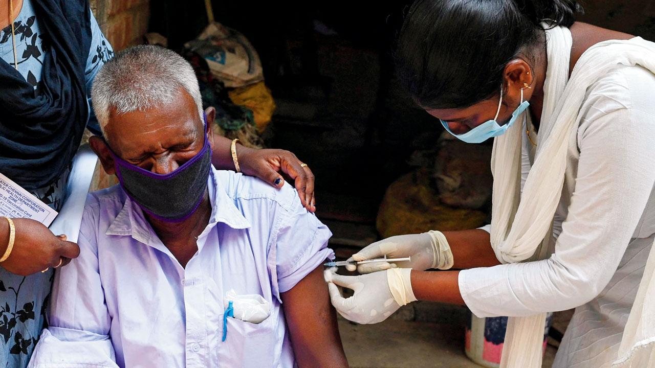 A senior citizen receives a vaccine shot in Chennai. File/AFP