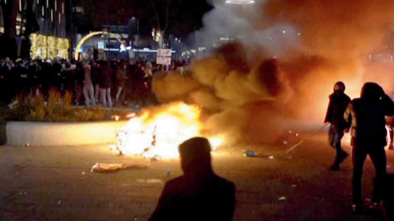 Dutch police open fire on rioters in Rotterdam