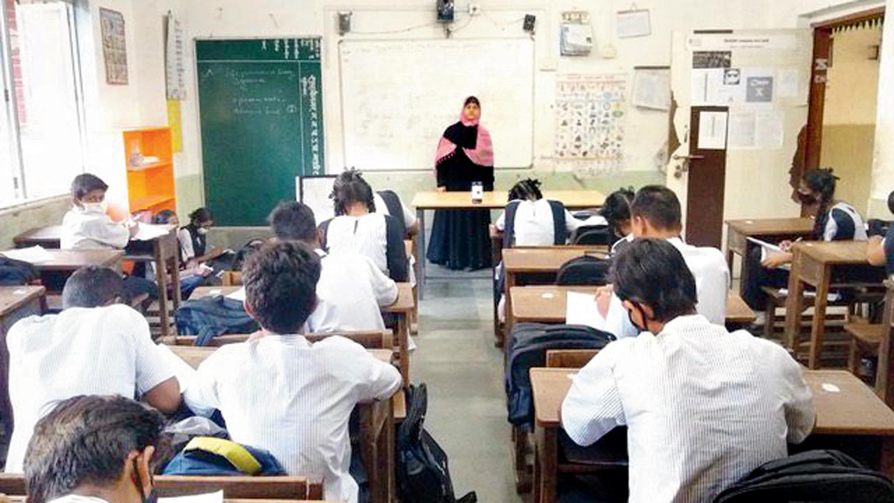 A teacher holds a full class at a BMC school in Shastri Nagar. Most kids here can’t afford a mobile or data bills