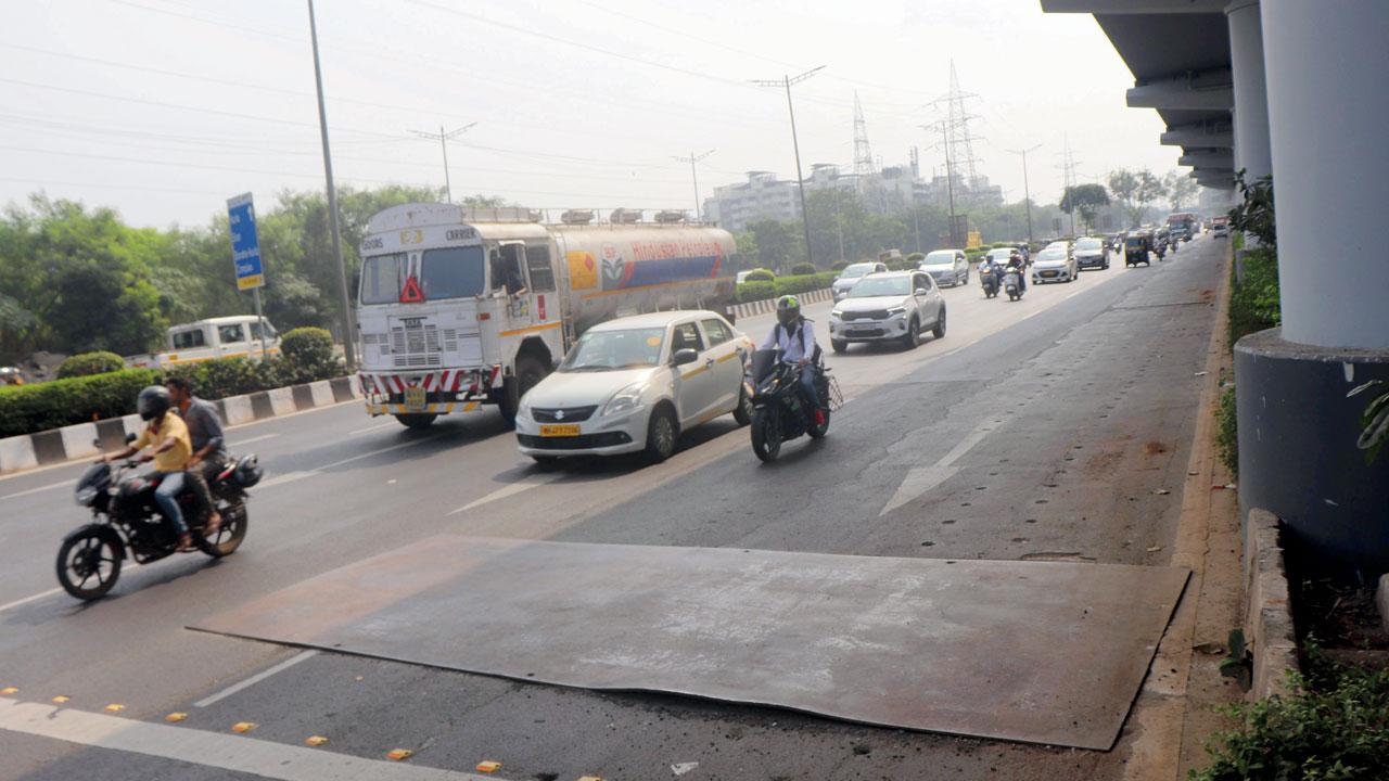An improperly fitted iron sheet is seen on the WEH, in Goregaon East, on Nov 15. File pic