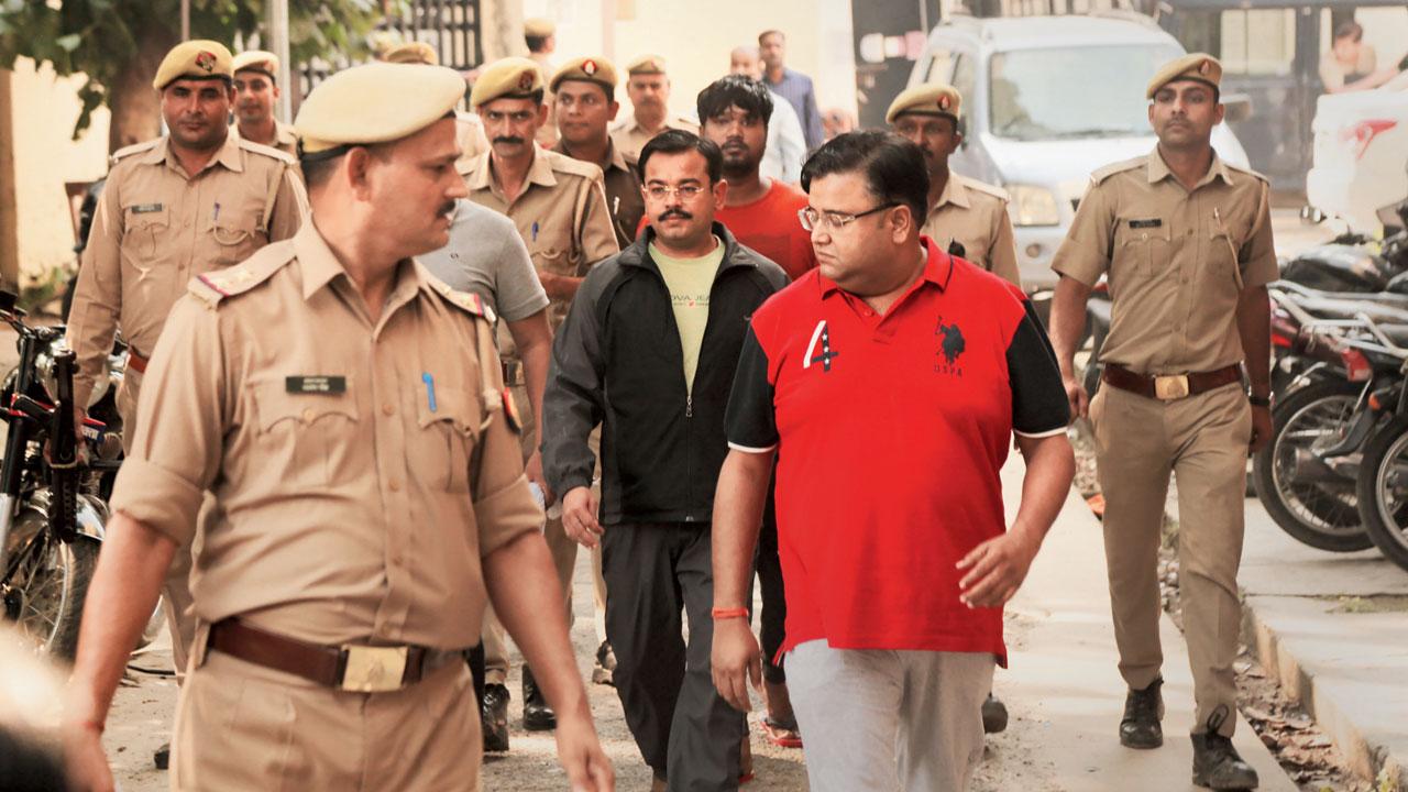 Ashish Mishra (centre) and other accused in the case, outside a court in Lakhimpur, on October 22. Pic/PTI