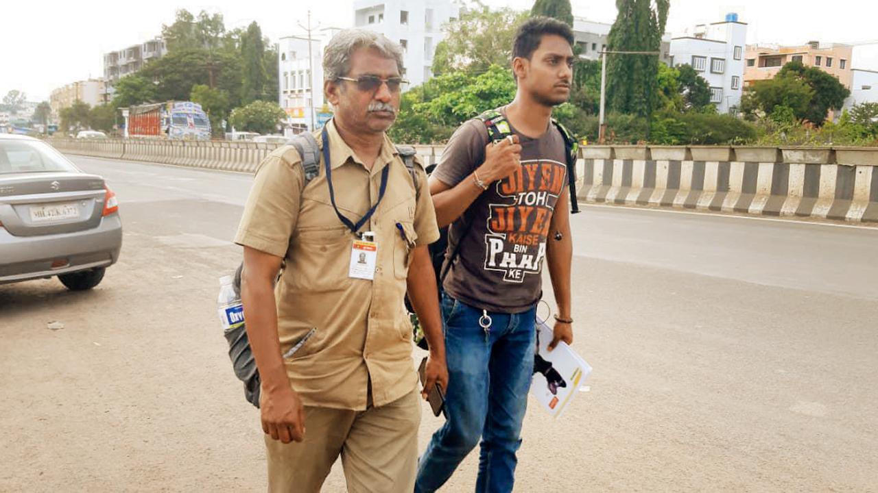Nitin Murlidhar Bhagwat, a social worker and bus conductor with the MSRTC, and his 21-year-old son Raj, walked from Baramati to Mumbai to protest at Azad Maidan