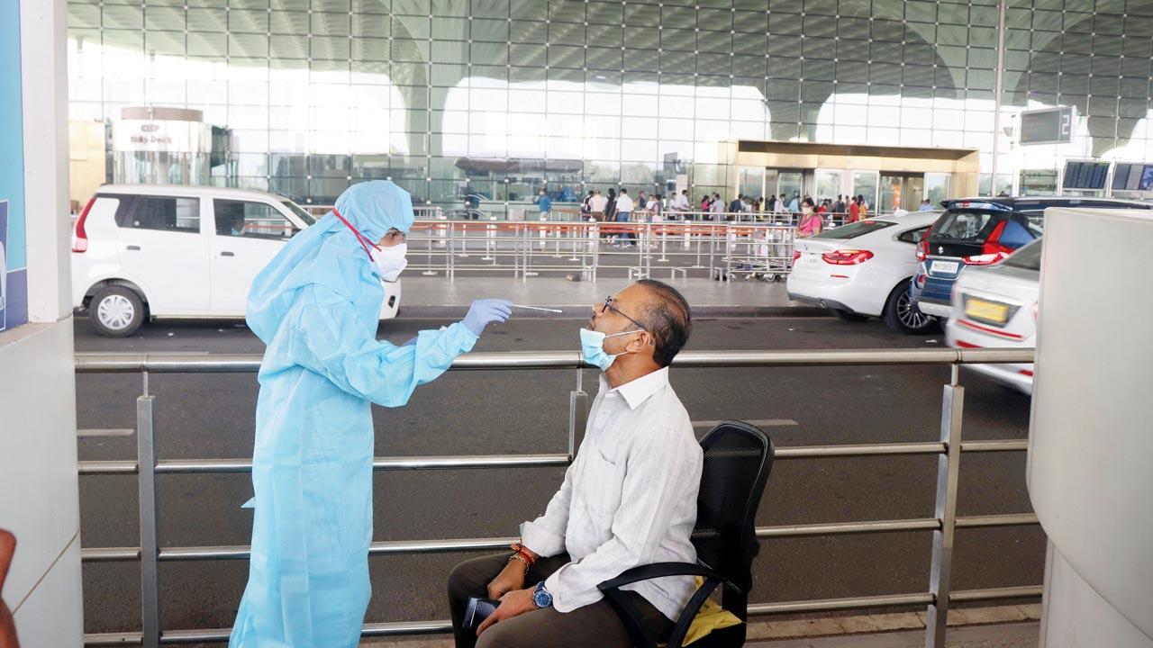  A traveller is tested for COVID-19 at Mumbai international airport. File pic/Anurag Ahire