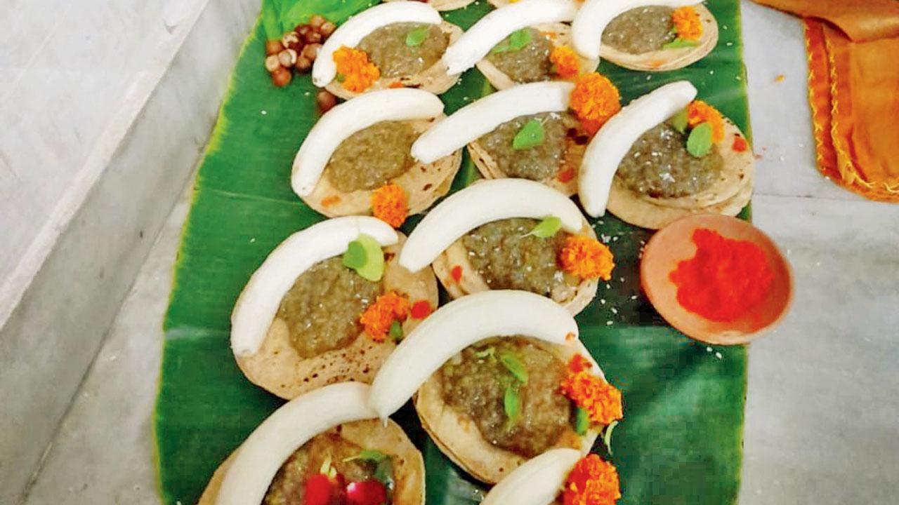 Rasiya offered to the deity with banana, roti and tulsi patta