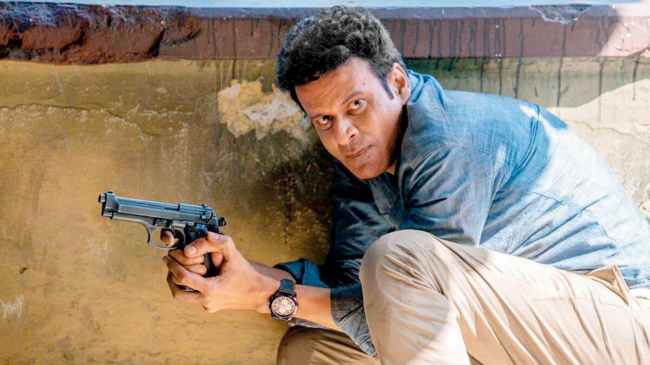 Manoj Bajpayee handling a gun in The Family Man franchise
