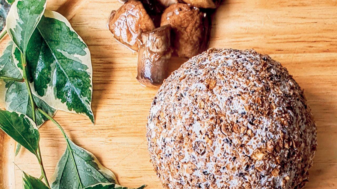 Truffle oil-infused cream cheese encased in smoked mushroom dust by ttttapas