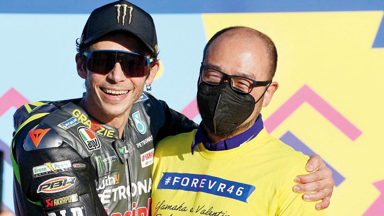 Valentino Rossi (centre) poses for a picture after the Valencia GP in Cheste, Spain on Sunday. Pic/AFP