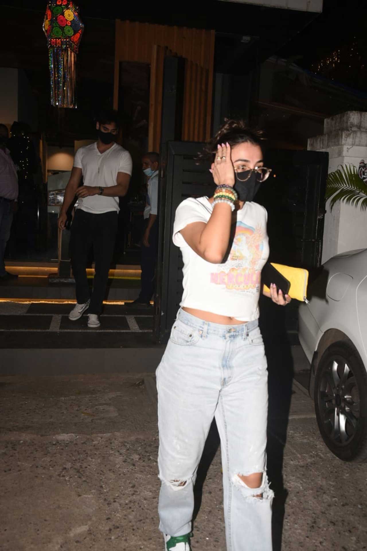 As Tania walked towards the car, Ahan Shetty was seen following soon after his ladylove. Ahan is all set to make his big Bollywood debut with Tadap. The film, directed by Milan Luthria, is a Hindi remake of Telugu hit RX100. It stars Tara Sutaria as the leading lady, along with Sikander Kher, Sharat Saxena, Naufal Azmir Khan, Suniel Shetty and Amit Sadh in supporting roles.