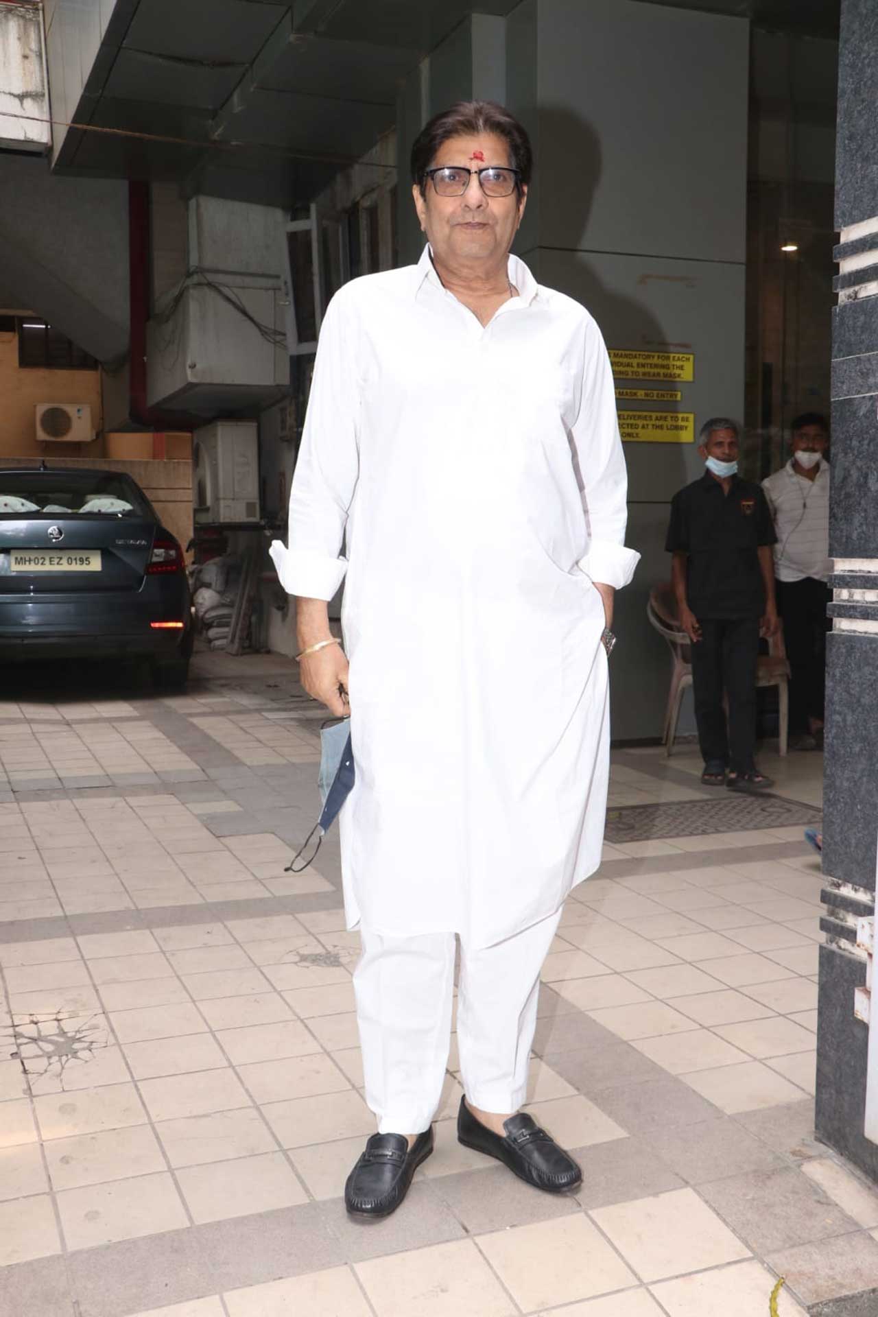 Varun Dhawan's uncle Anil Dhawan too was spotted arriving for the pooja. He wore a white kurta pyjama and posed for pictures.