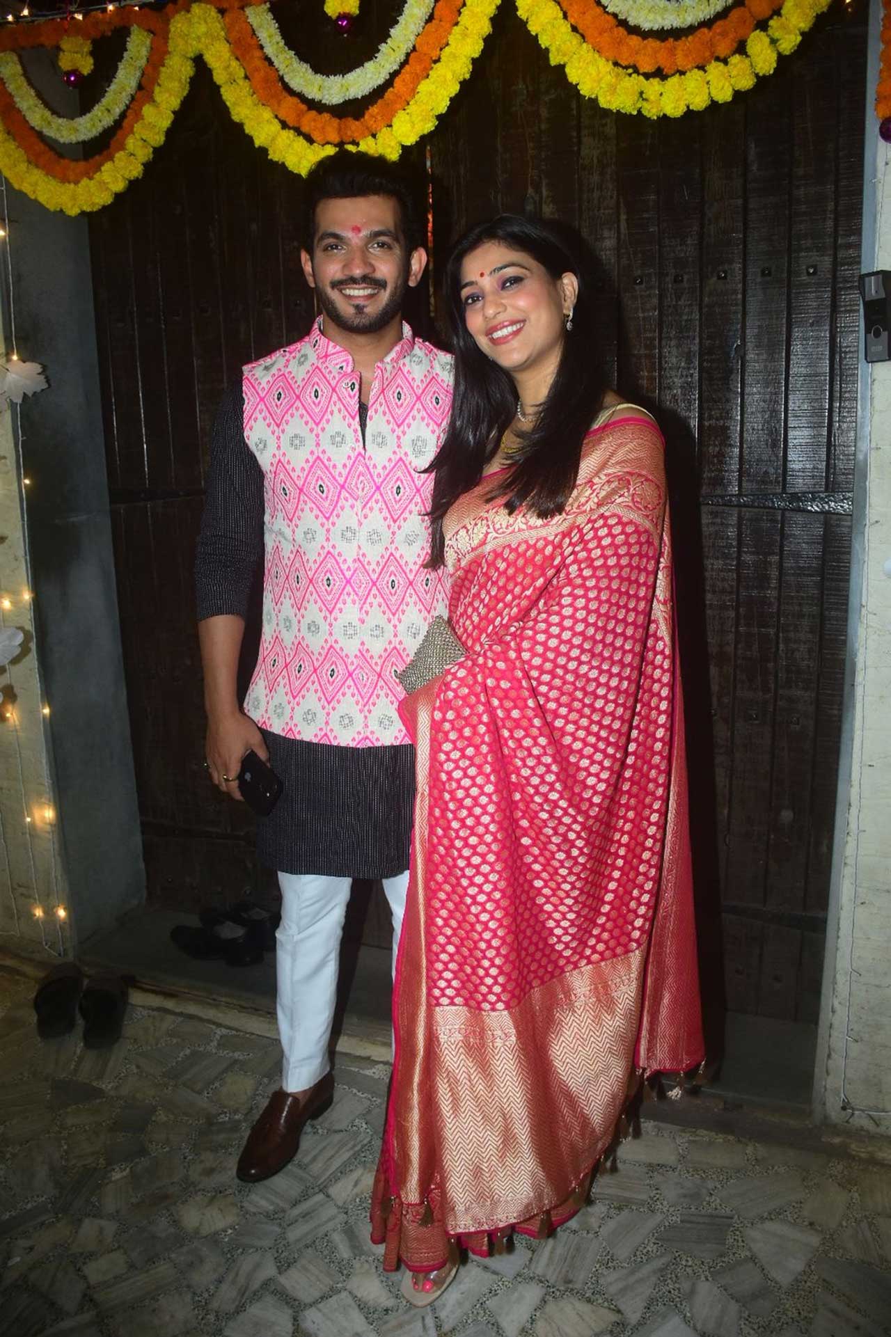 Khatron Ke Khiladi winner Arjun Bijlani arrived with wife Neha Swami. The couple complemented each other with outfits in shades of pink. 