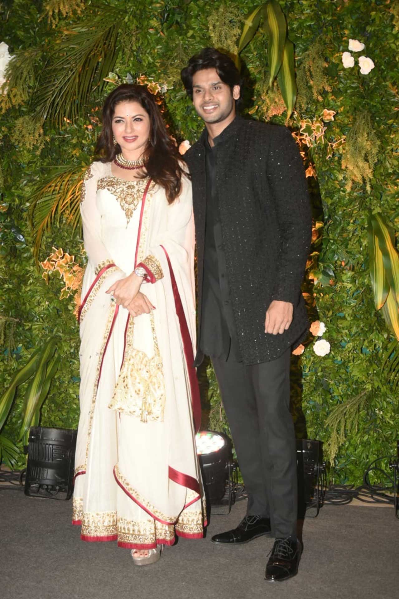 Bhagyashree wore an all white outfit with maroon borders and golden embellishments. She was accompanied by son Abhimanyu Dassani who wore a black shirt with black pants and black embellished jacket. 