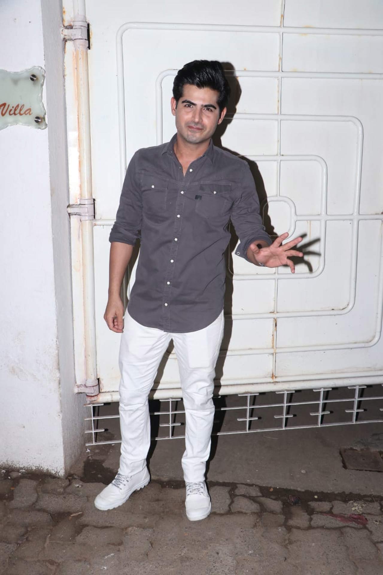 Omkar Kapoor waved at the paparazzi as he attended the special screening.