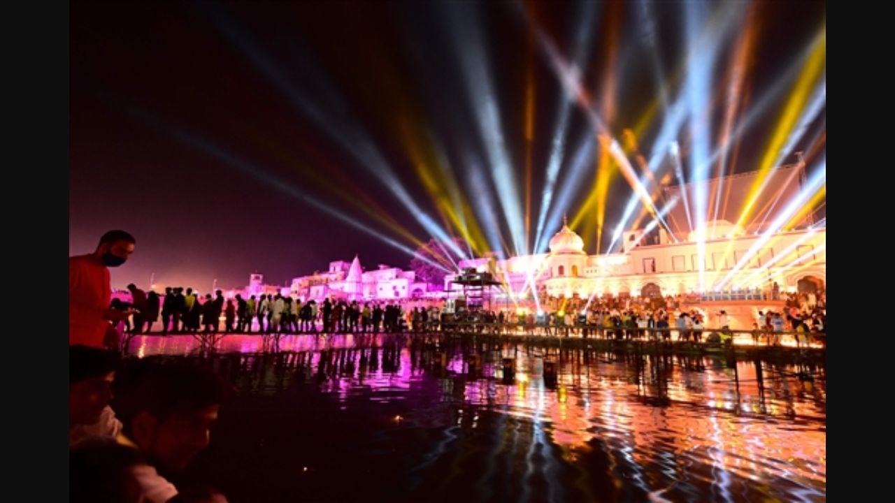People watch a laser show on the banks of the river Sarayu during Deepotsav celebrations on the eve of the of Diwali in Ayodhya. Pic/PTI