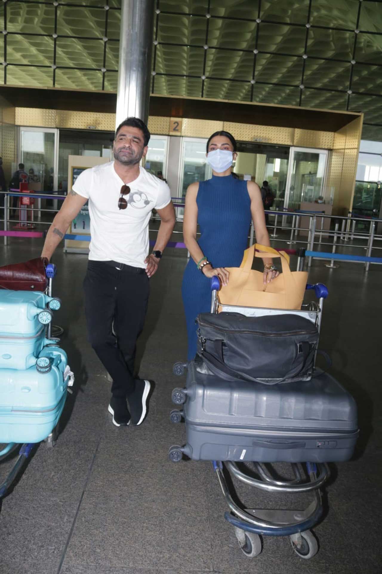 Today the lovebirds were spotted at the airport and as usual, their chemistry grabbed everyone's attention. Eijaz Khan kept his airport look basic with a white tee and black pants. Pavitra chose a comfy yet stylish blue dress for the journey.