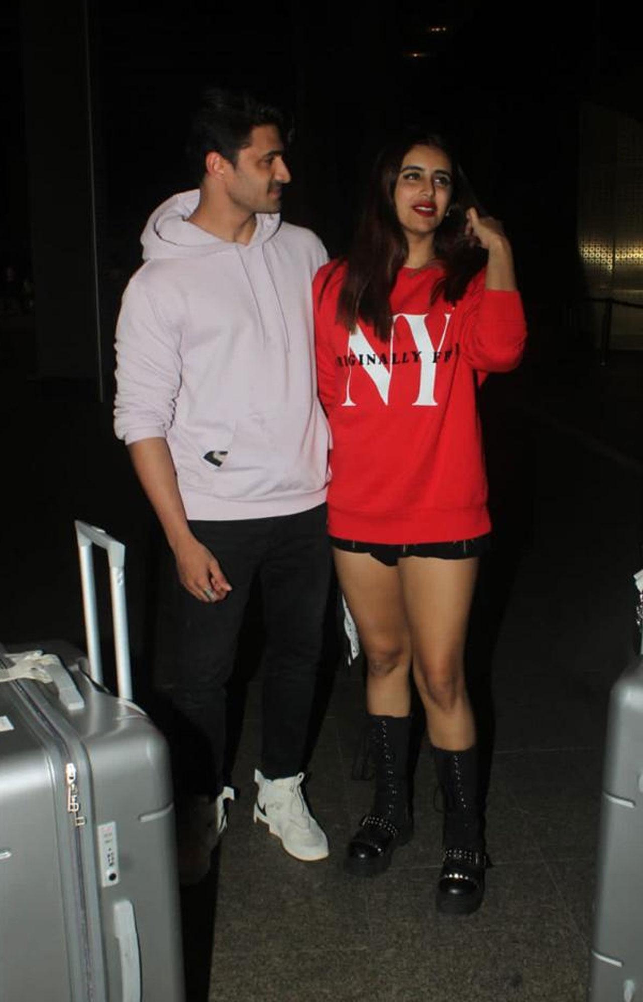 The Bigg Boss house isn’t all about cacophony, sometimes, Cupid strikes the contestants too. It has Ieshaan Sehgaal and Miesha Iyer. They were spotted arriving together, holding hands, smiling at each other, at the Mumbai airport.