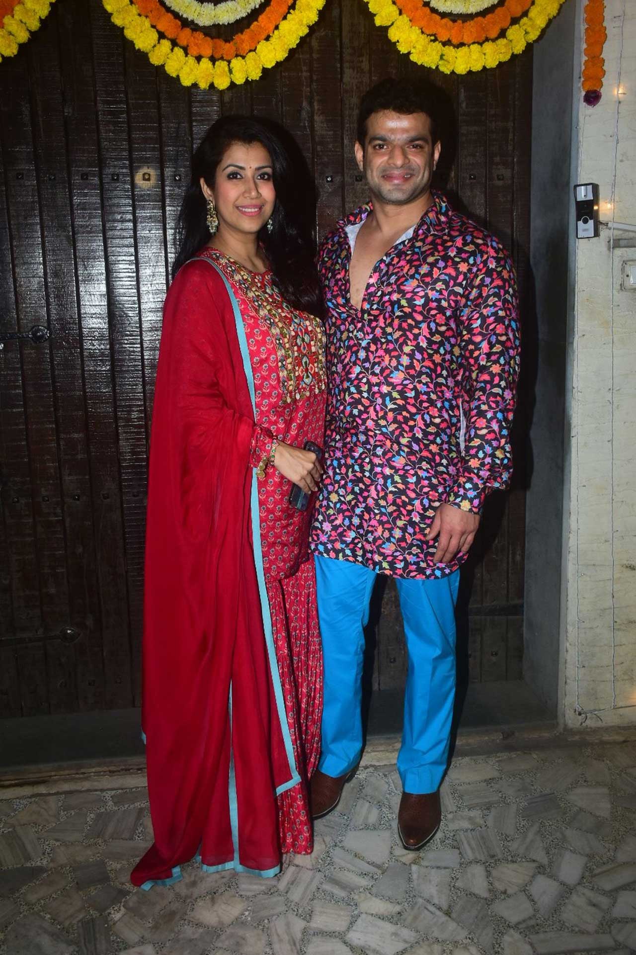 Host Karan Patel wore a multi-coloured floral kurta which he paired with a pair of denims. Wife Ankita Bhargava dazzled in a gorgeous red Anarkali suit. 