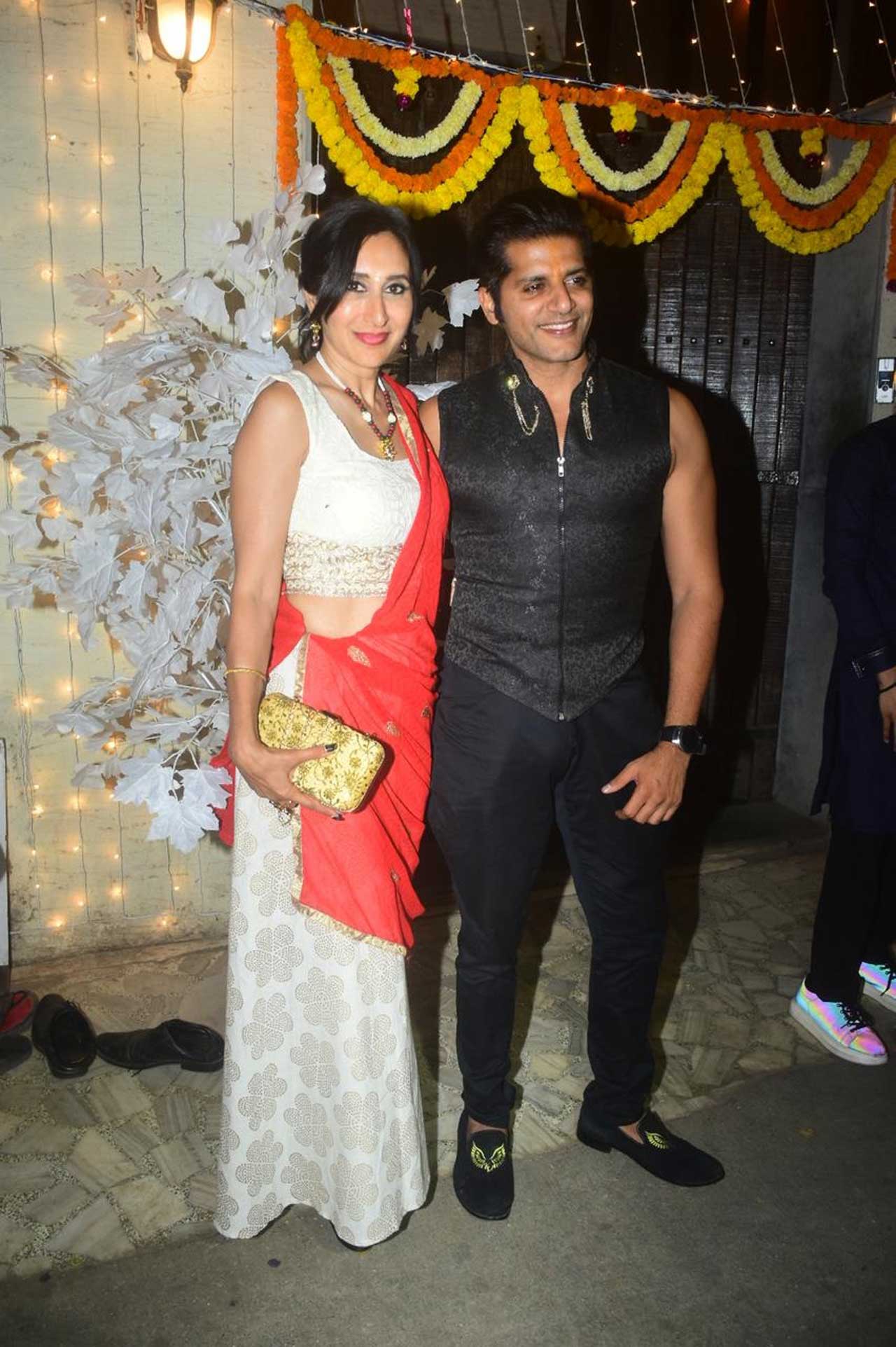 Karanvir Bohra and Teejay Sidhu made a lively appearance before the paparazzi. Karanvir donned an all black look, whereas Teejay chose a red and white outfit for the Diwali party.