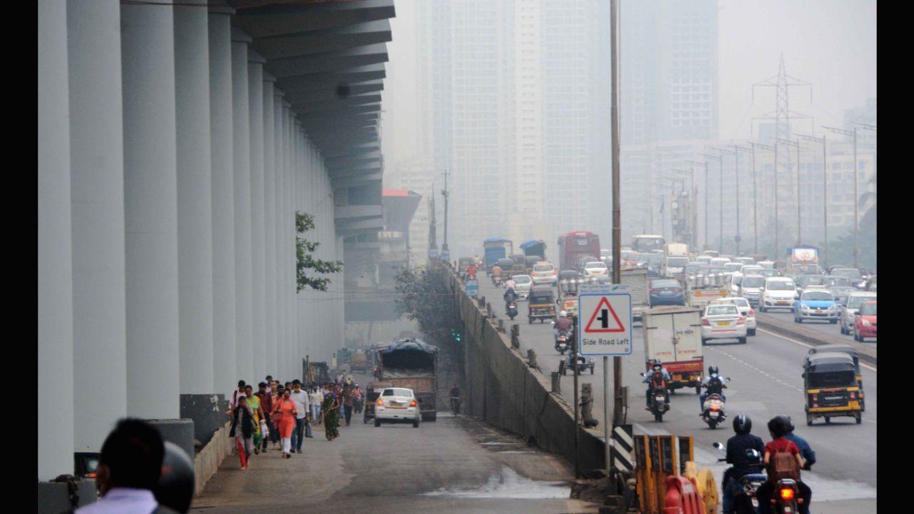 Commuters travelling amid smog conditions as air quality continues to deteriorate in Mumbai.