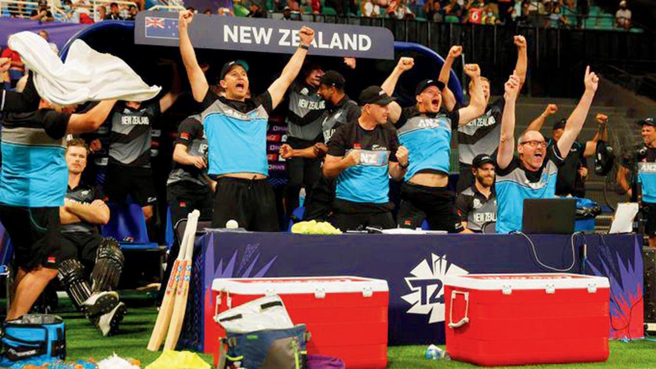 The viral image of Jimmy Neesham (sitting, left) who did not move an inch amidst an ecstatic NZ dugout after beating England in the semis