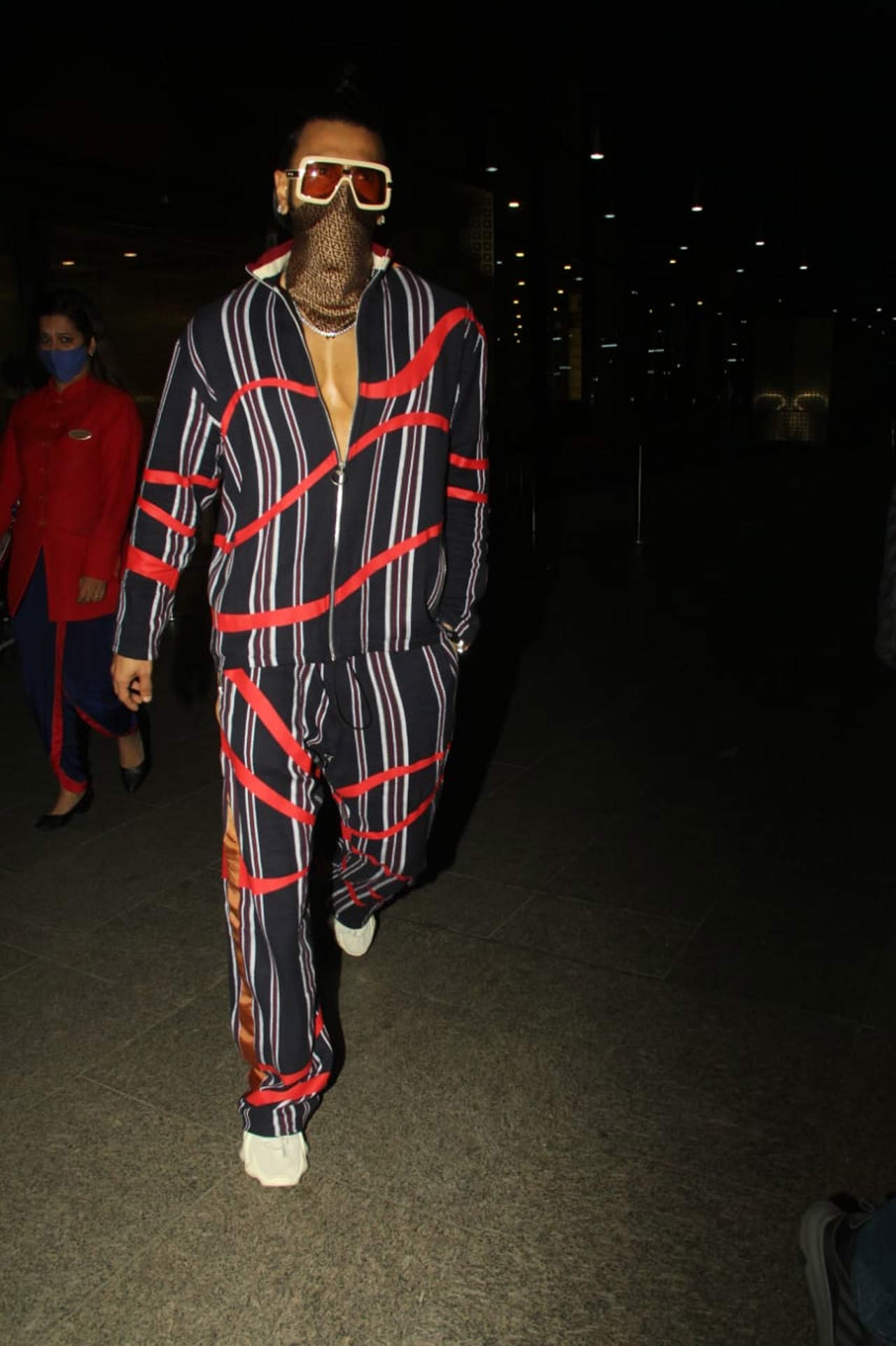Ranveer Singh yet again flaunted his whacky side when snapped by the shutterbugs at the Mumbai airport. The actor sported a trendy tracksuit for his outing, and we can't get our eyes off from his funky airport look.