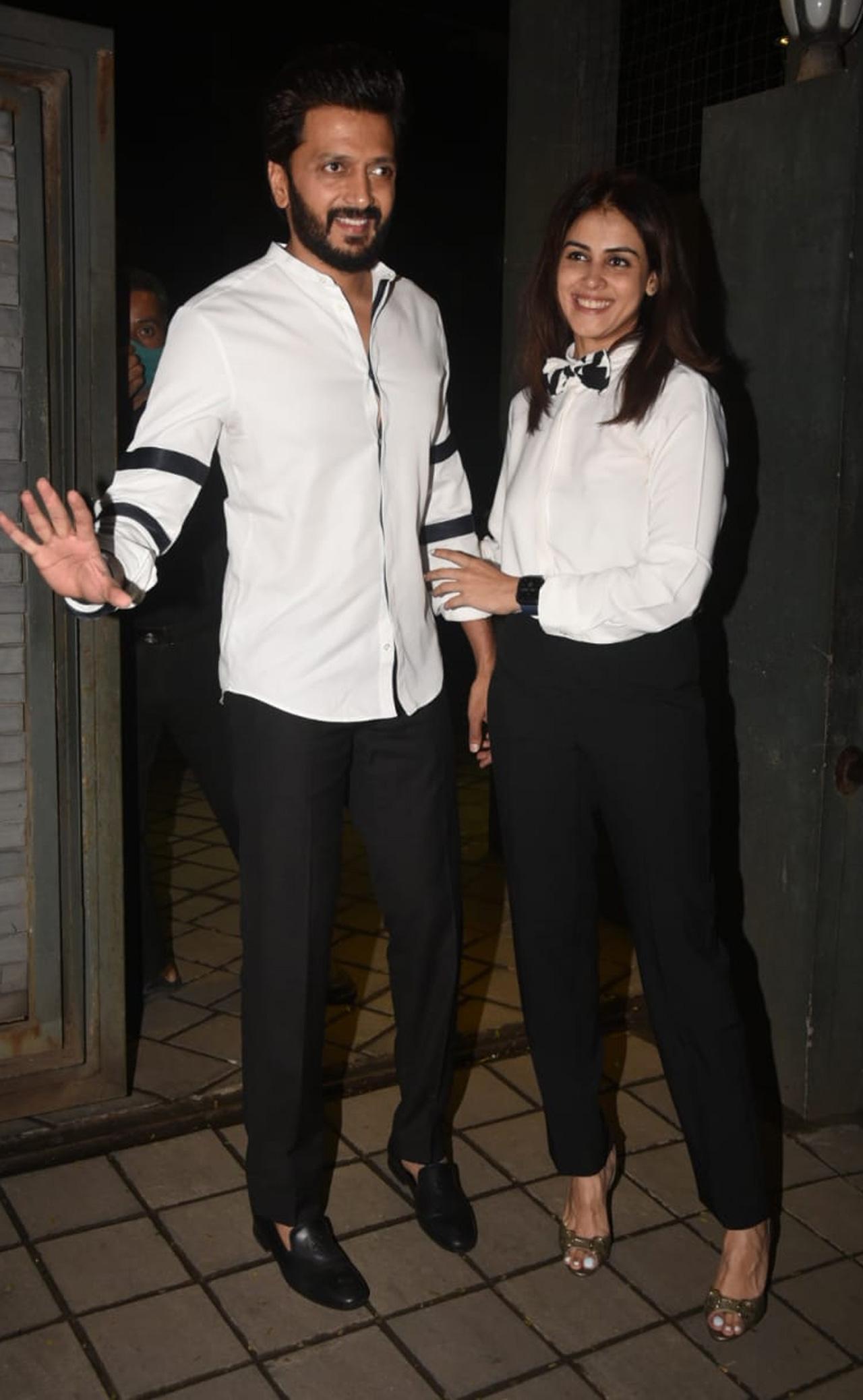 Bollywood couple Riteish Deshmukh, Genelia D'Souza twinned in white and were all smiles as they were clicked at Arpita Khan and Aayush Sharma's residence.