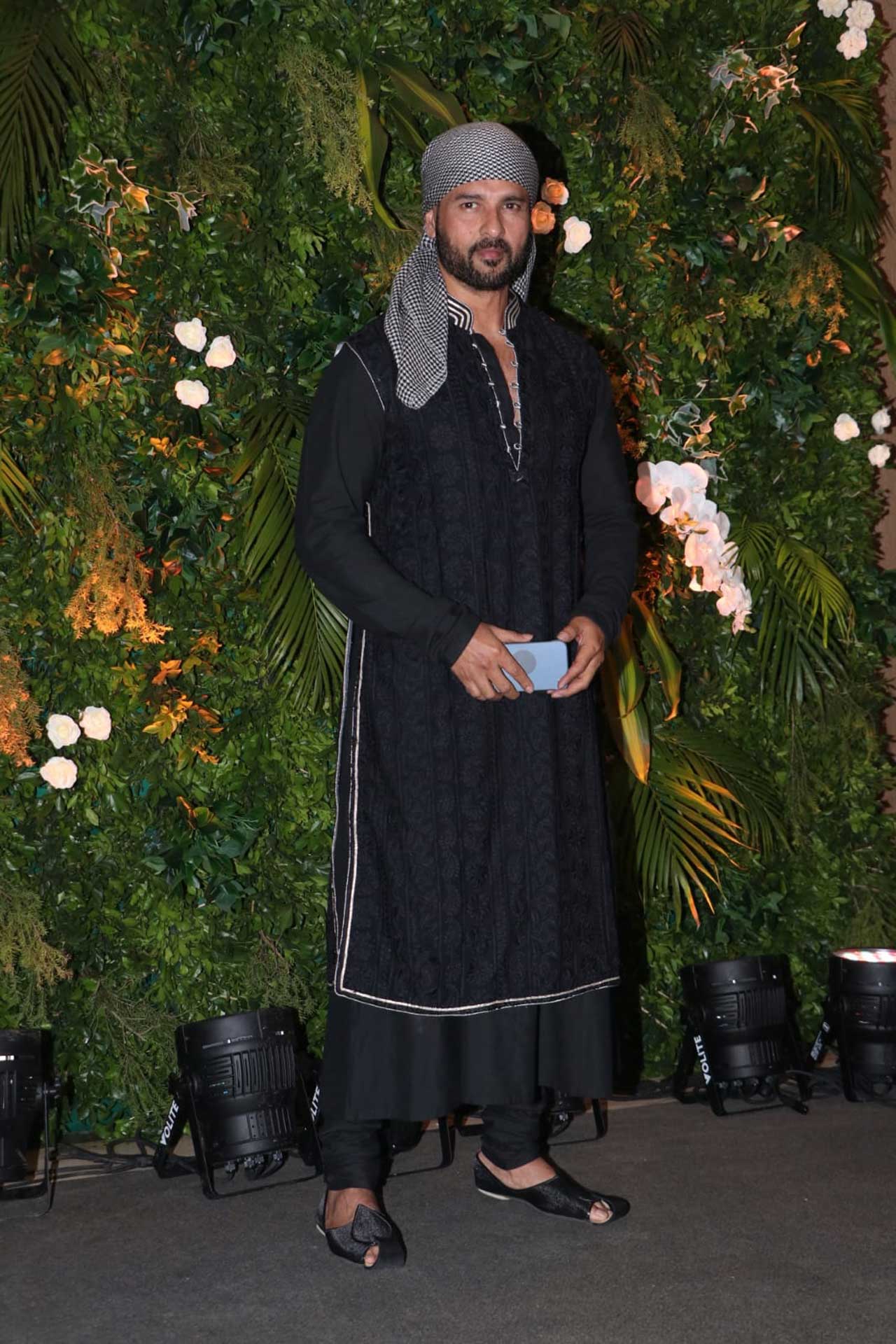 Rohit Roy stood out with his look wearing a black embroidered kurta complemented with black mojris and a checkered bandana.