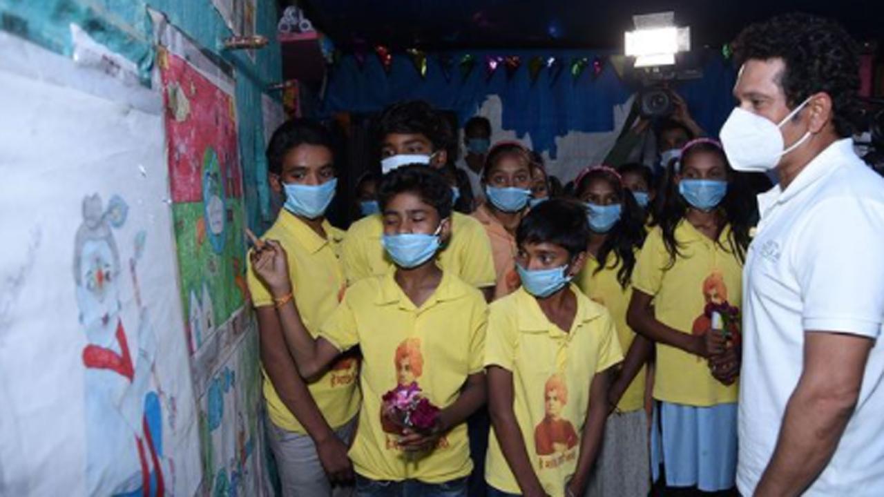 See photos: Sachin Tendulkar visits MP village, extends support to children's education