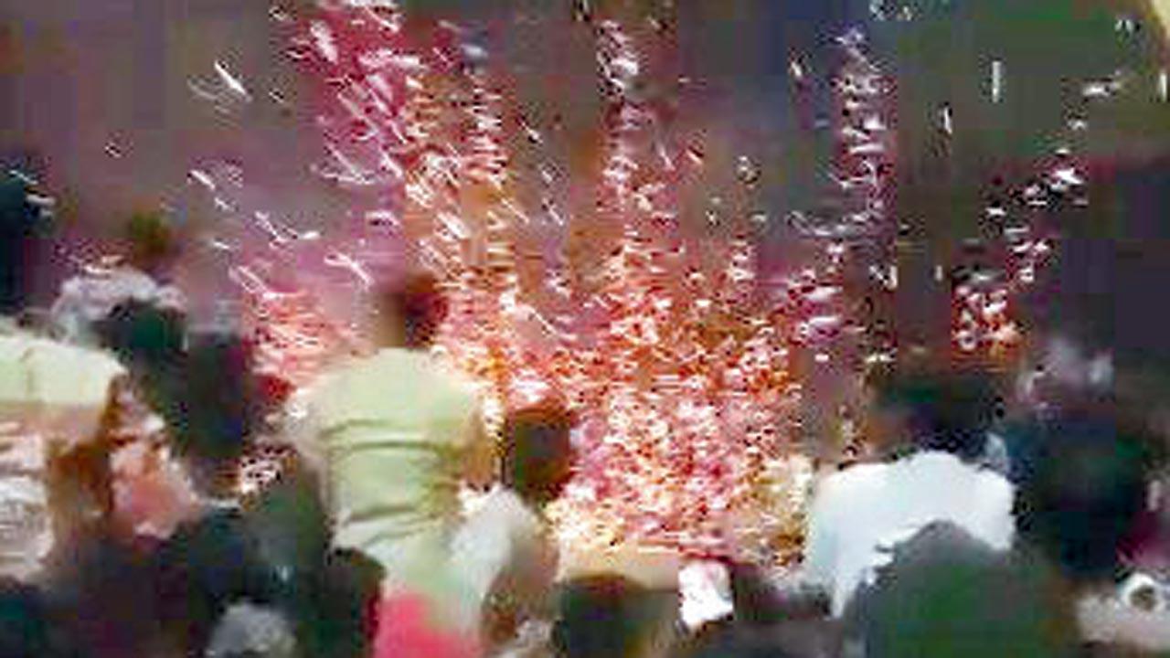 A screengrab from the video showing fans bursting crackers