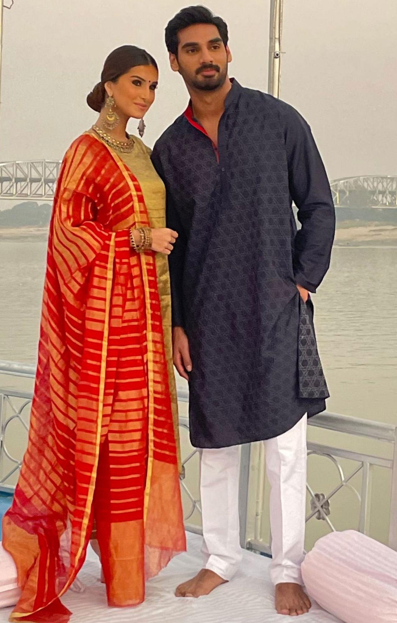 Ahan Shetty and Tara Sutaria were in Varanasi to seek blessings for their film Tadap. Before performing the Ganga Aarti, the lead pair of Milan Luthria's film was clicked together for a picture and needless to say, acted its traditional look for the evening.