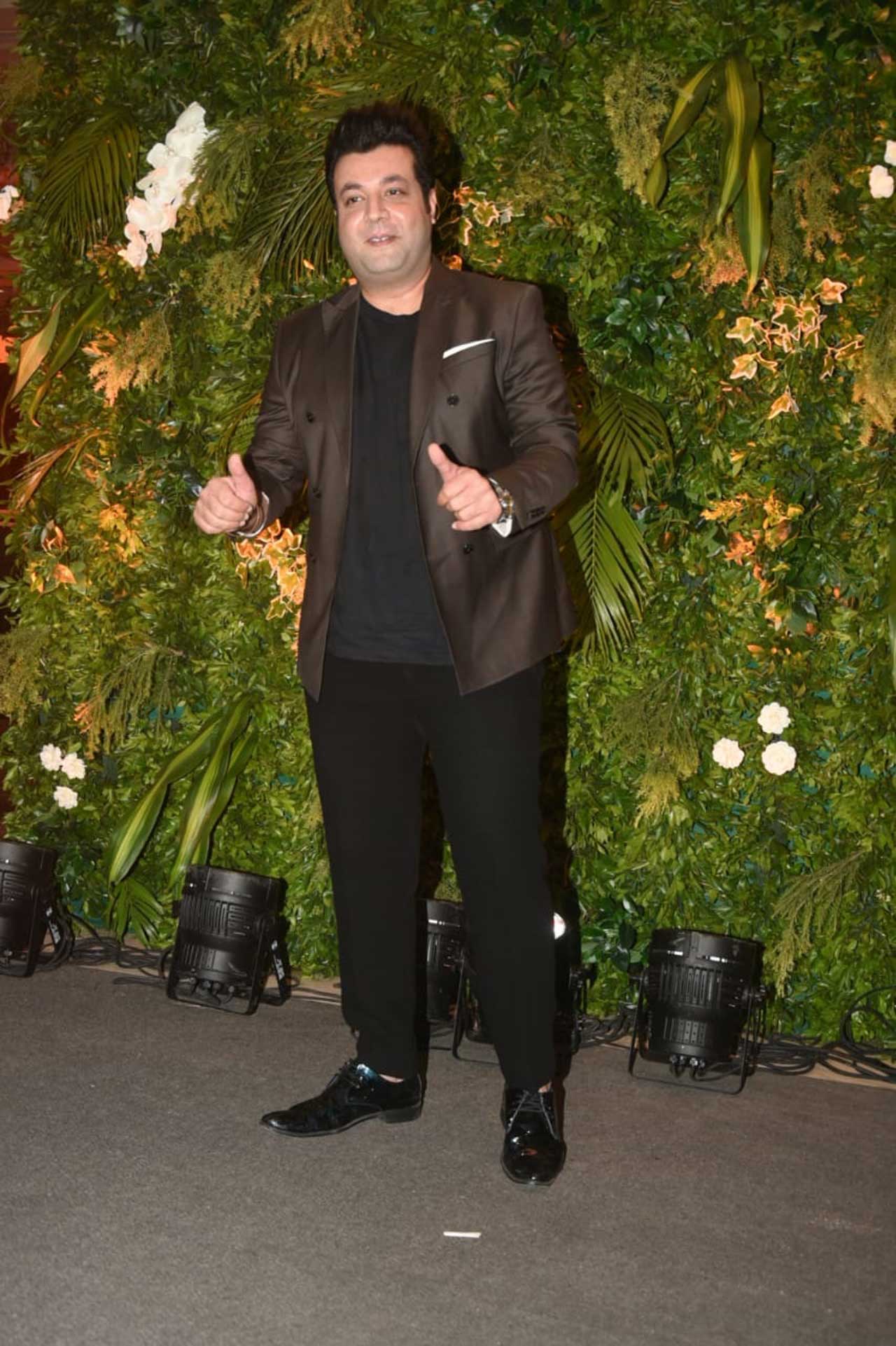 Varun Sharma kept it simple with black pants and black t-shirt complemented with a dark tan jacket and black shoes. 
