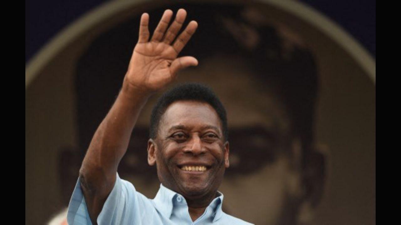 Former Brazilian footballer Pele waves to the crowd before the start of the Under-17 boys final match of the Subroto Cup in New Delhi on October 16, 2015. Photo: AFP