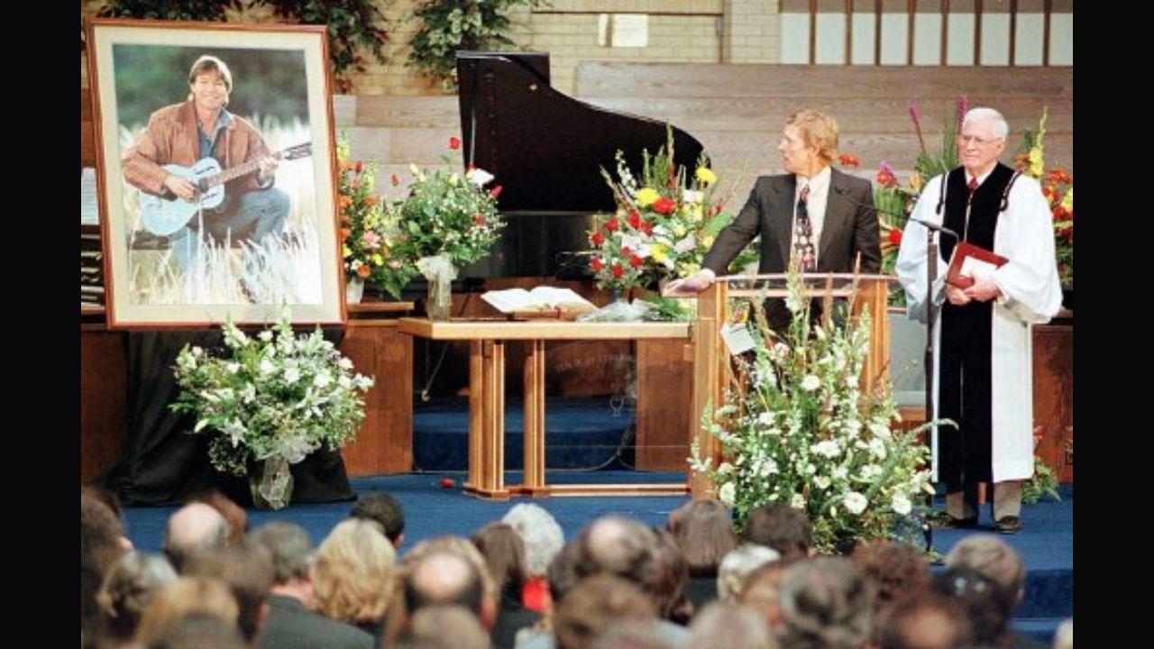 The American singer-songwriter died on October 12, 1997 at the age of 53 after his airplane crashed into Monterey Bay. After hearing about his death, Colorado Governor Roy Romer ordered that all state flags be lowered to half-mast in his honour. Denver’s funeral was held at the Faith Presbyterian Church in Aurora, Colorado. He was then cremated and his ashes were scattered in the Rocky Mountains. Tom Crumb (centre) looks to a portrait of his long-time friend John Denver while Pastor Les Felker stands by during a eulogy he gave at Denver's memorial service at the Faith Presbyterian Church in Aurora, Colorado. Photo: AFP