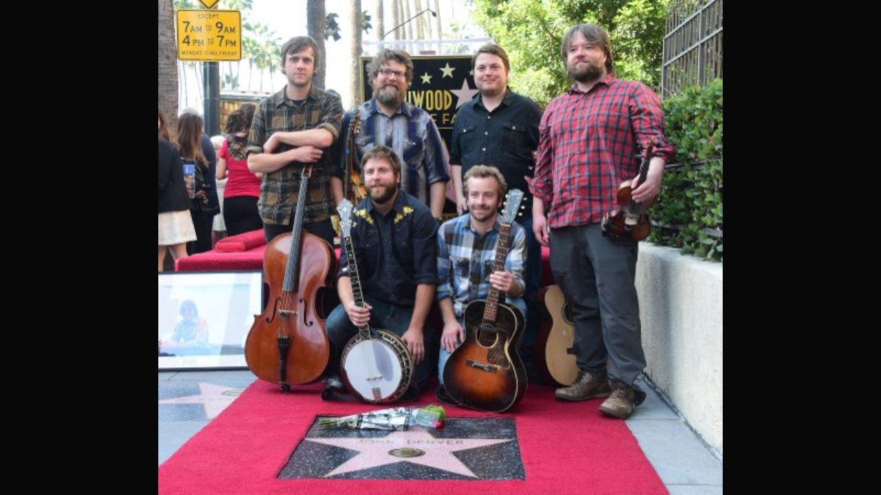 After the success of ‘Leaving on a Jet Plane’, the American singer recorded two more albums in 1970 called ‘Take Me to Tomorrow’ and ‘Whose Garden Was This’. However, it was the 1971 album ‘Poems, Prayers & Promises’ that made him famous in the US for the song ‘Take Me Home, Country Roads’, which reached No. 2 on the Billboard charts. By 1975, the singer had four songs at No. 1 and three No. 1 albums to his credit. In 1974, he also released the single ‘Annie’s Song’, among his most popular, based on his first wife Annie Martell after they had had an argument. Members of the band 'Trampled by Turtles' who performed 'Annie's Song' pose on the late John Denver's posthumous Hollywood Star ceremony in 2014. Photo: AFP