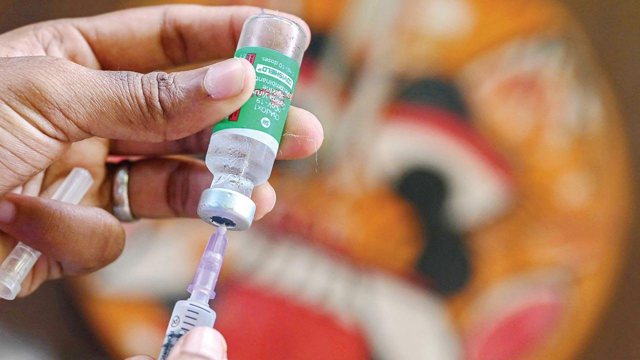 A medic prepares a Covishield jab during a vaccination drive in Chennai. File pic/AFP