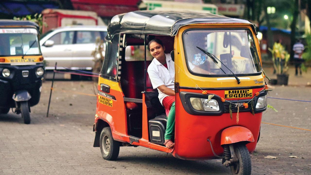 Alka Jadhav with her auto at Bandra on Tuesday. Pic/Shadab Khan